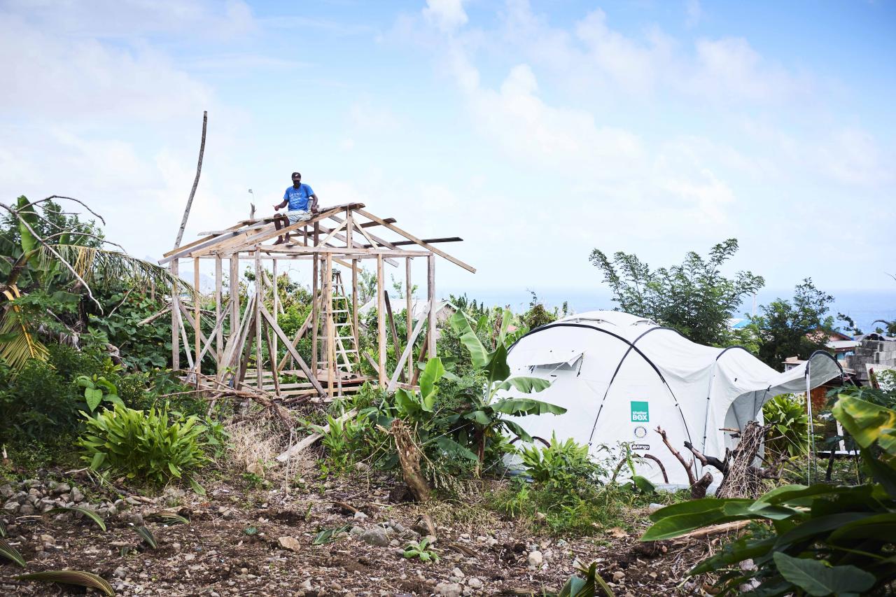 In the small island of Barbuda, we supported over 200 households. Here, a local is already in the process of repairing his home.