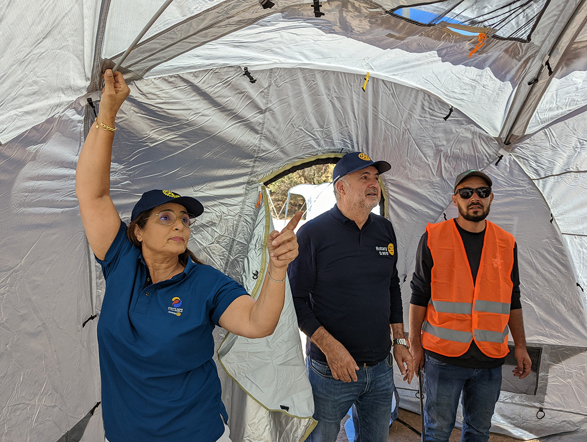 DG Saadia Aglif with Jalal Zemmama and a local leader Abdul putting up a ShelterBox tent